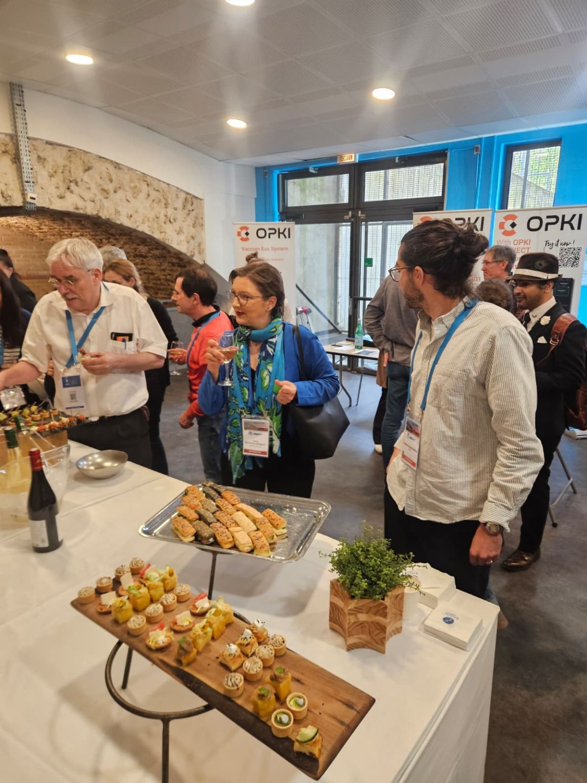Participants meeting near the OPKI stand at JNSPE 2026