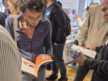 Visitors reading the OPKI brochure during RT Vide 2026